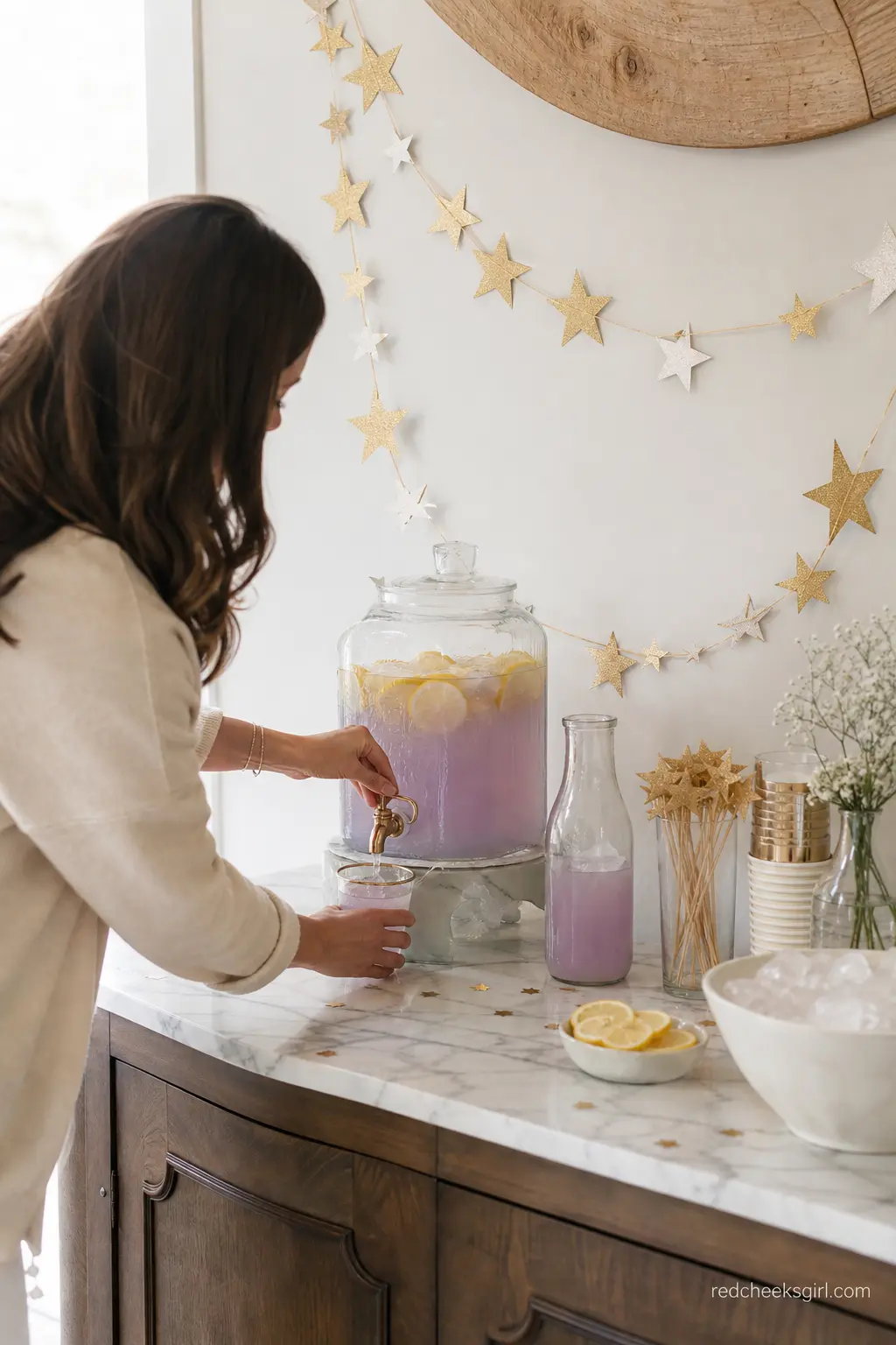 Sip Under the Stars Drink Station — A small console with glass dispensers of lavender lemonade and gold star stirrers keeps drinks self serve and on theme.