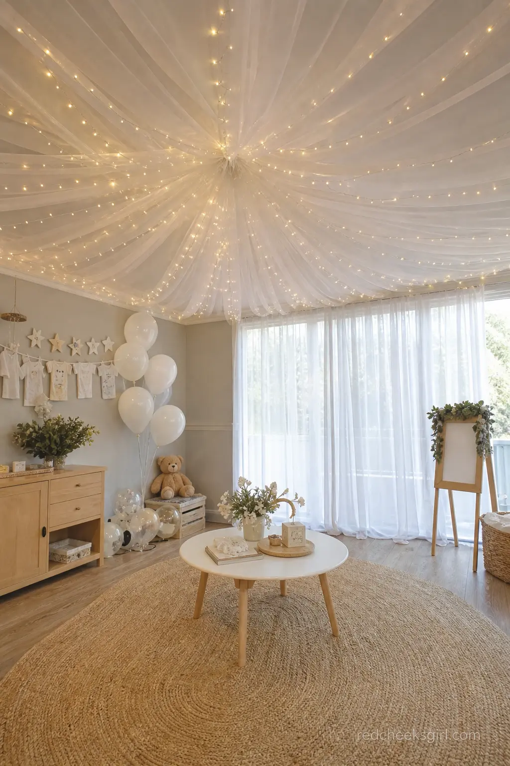 Twinkle Light Ceiling Canopy — A canopy of warm fairy lights and sheer white fabric stretched across the ceiling above one seating area gives the room a