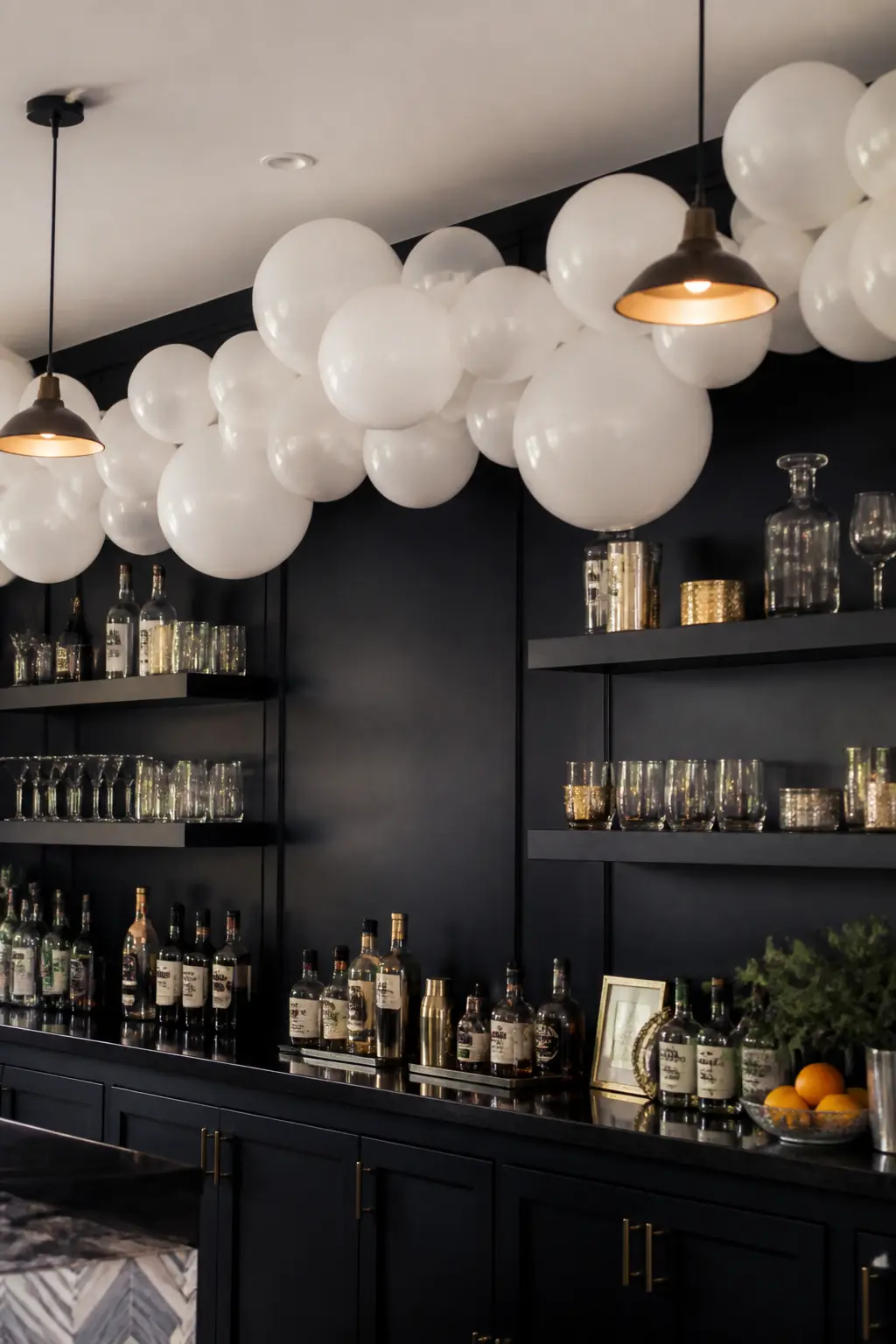 White Garland Against a Dark Wall Behind a Bar — A white garland against a dark wall is the highest-contrast white balloon installation possible. White balloon
