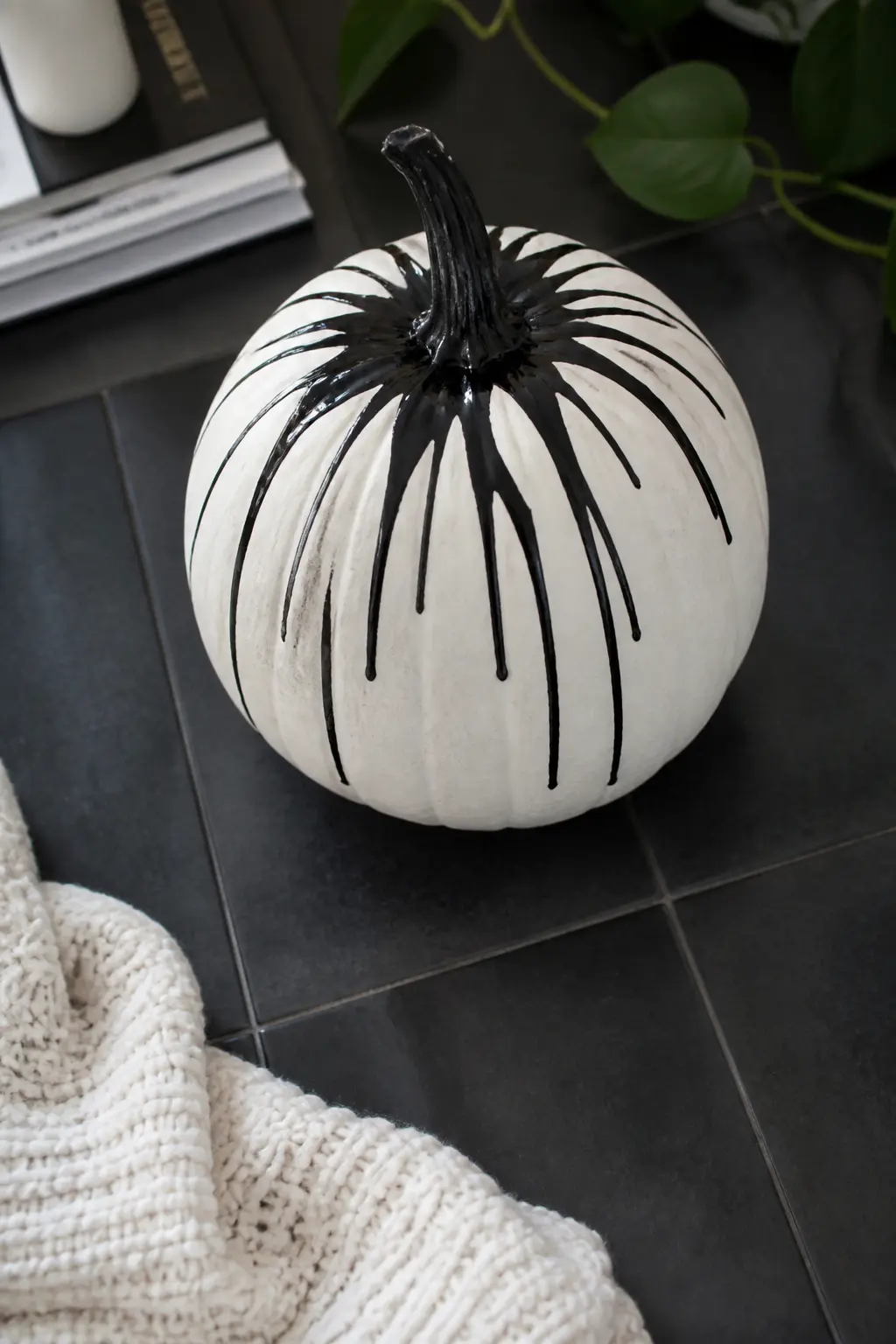Black Drips From the Stem — Black paint runs in controlled drips downward from the stem, some short and some reaching halfway down the body, creating a graphic