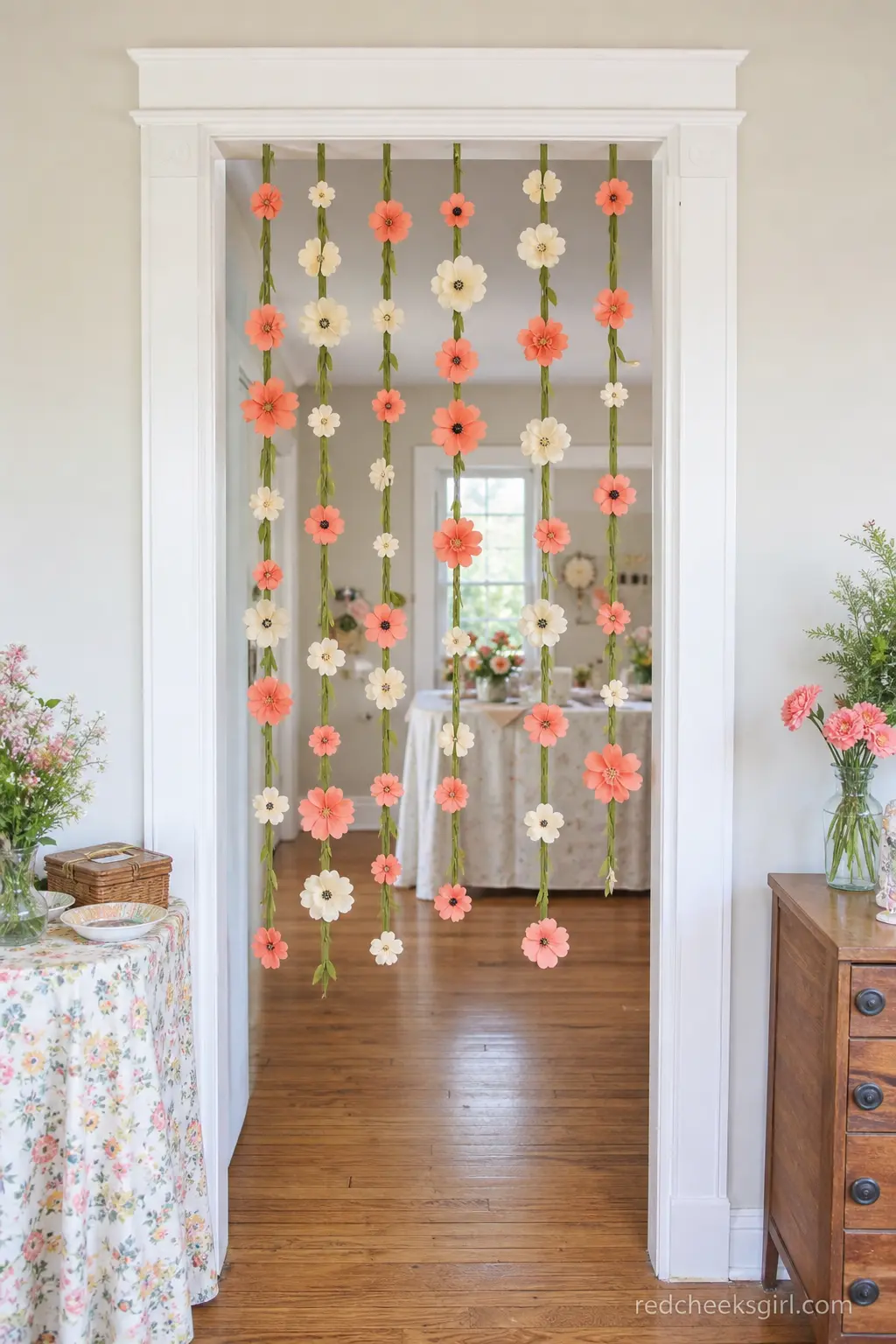 A Hanging Wildflower Curtain in the Doorway — No porch, no problem: a curtain of paper wildflowers hung on a tension rod turns any interior doorway into the