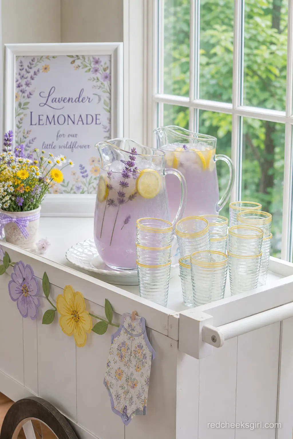 A Lavender Lemonade Cart — A small bar cart with a jug of lavender-tinted lemonade does double duty as decor and refreshment, and it needs no ice bucket refill