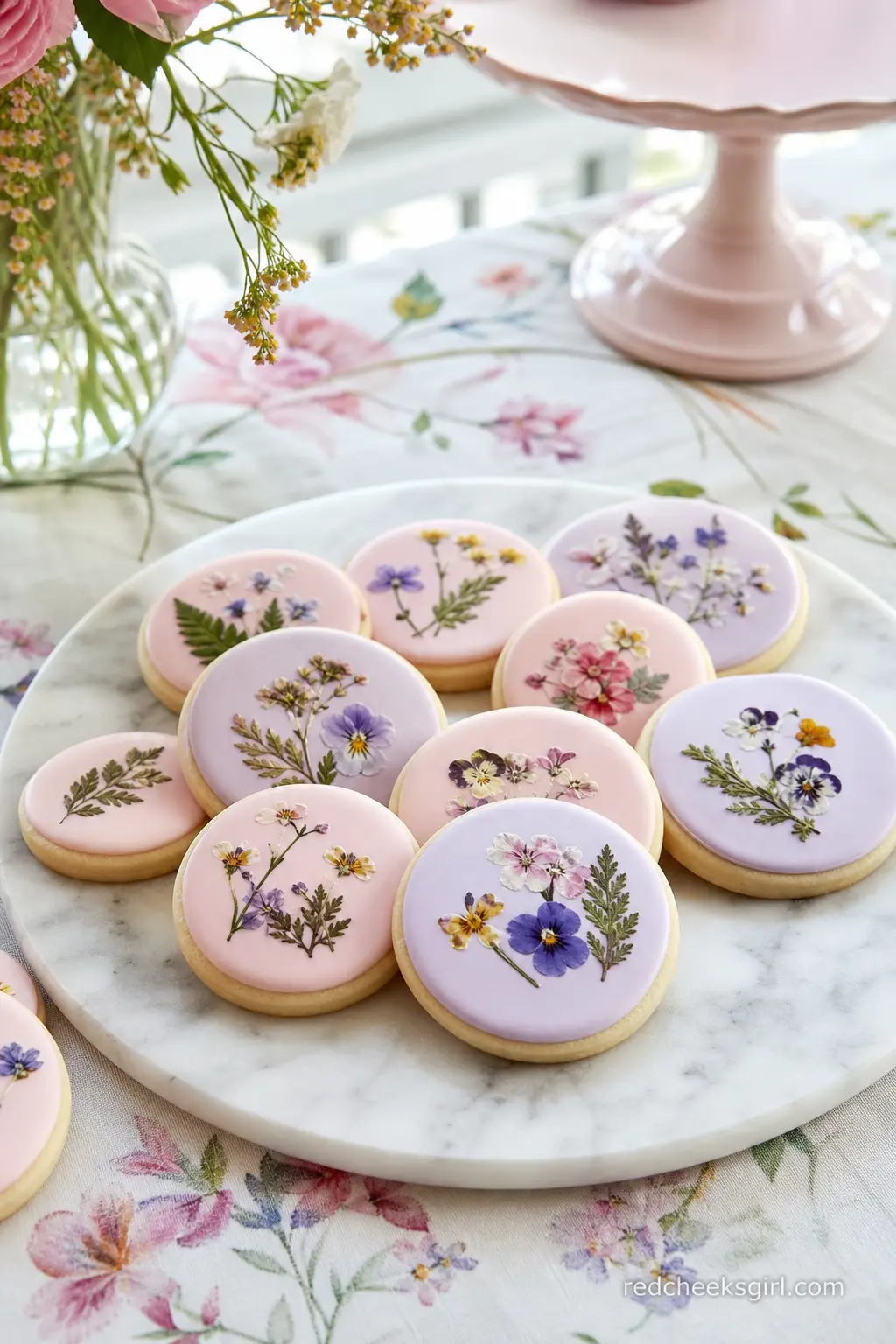 A Platter of Pressed-Flower Sugar Cookies — Sugar cookies iced with a pastel base and a small edible flower transfer or hand painted detail travel and stack
