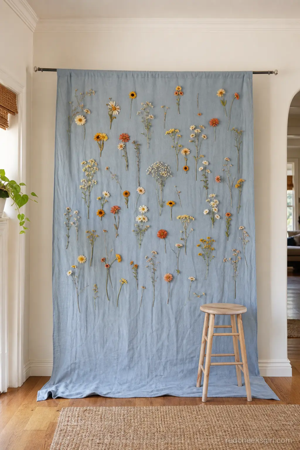 A Pressed-Flower Backdrop for Photos — A single length of dyed fabric pinned flat to a wall does more work than a rented flower wall, at a fraction of the