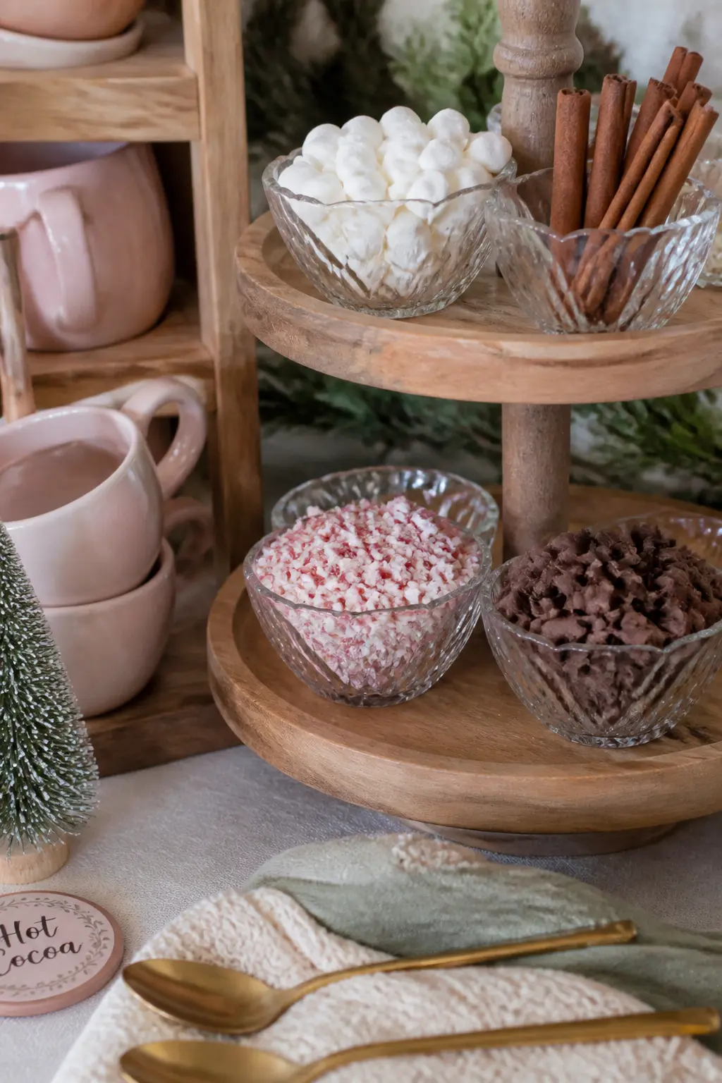 Hot Cocoa Bar with a Tiered Topping Station — A hot cocoa bar is the single most beloved feature of a winter shower. Winter Baby Shower Ideas