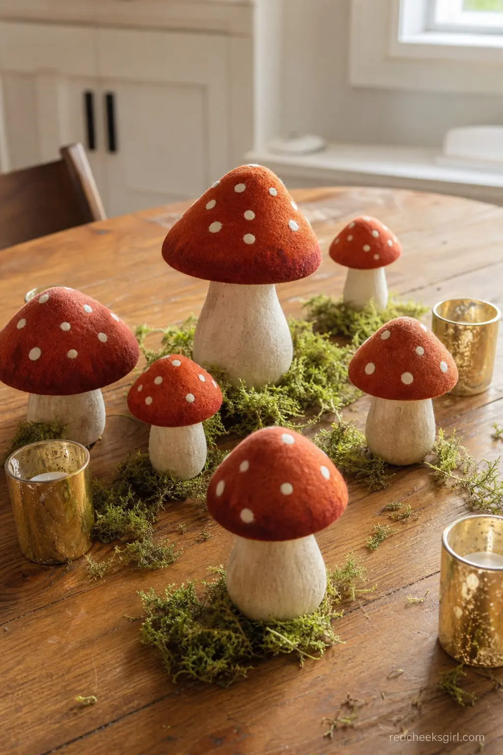 A Cluster of Faux Mushroom Centerpieces — Ceramic or felt mushrooms in rust red with white spots, grouped in threes down each table with a scattering of moss