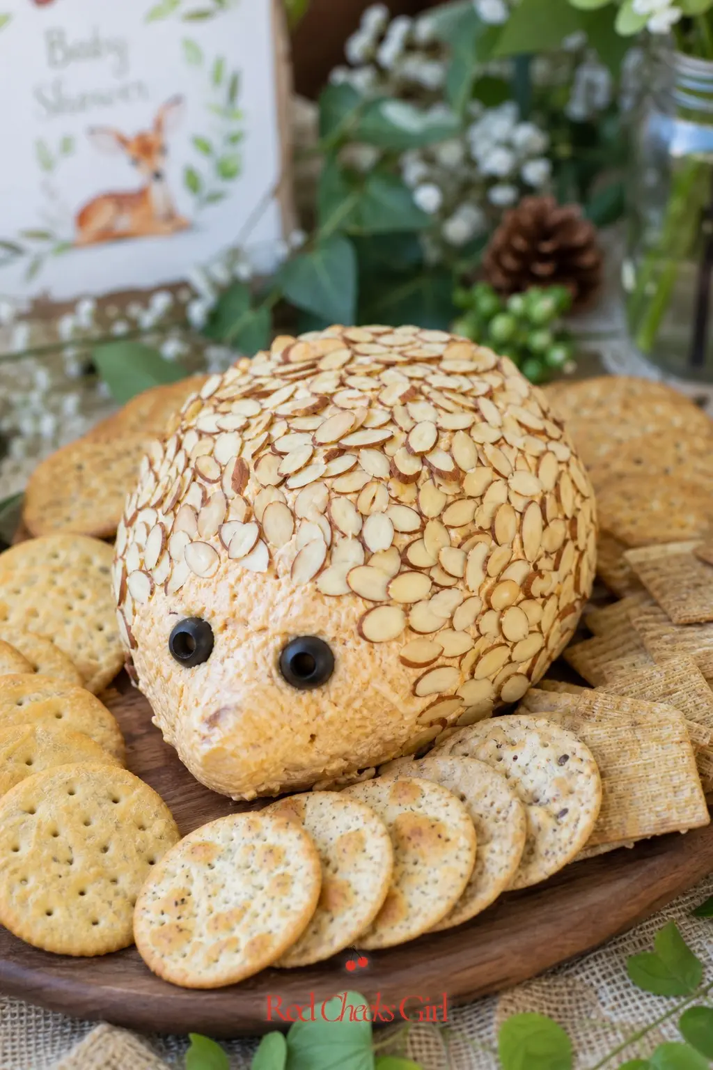 A Hedgehog Cheese Ball Centerpiece — A classic cheese ball, shaped into an oval and studded with sliced almonds for quills, sits happily on the savoury end of