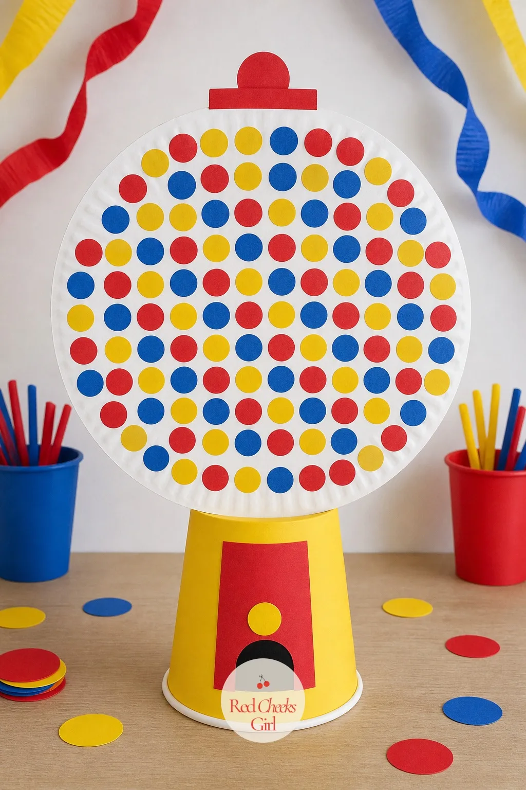 The Paper Plate Gumball Machine — A paper plate glued to a cup does not sound like a centrepiece, right up until it is covered edge to edge in a hundred dots