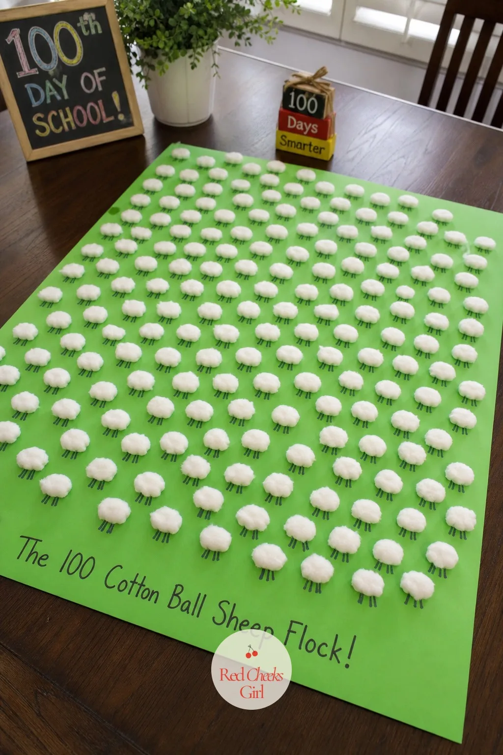 The 100 Cotton Ball Sheep Flock — Paint a meadow green background first and let it dry while the cotton balls get stretched thin between two fingers, which