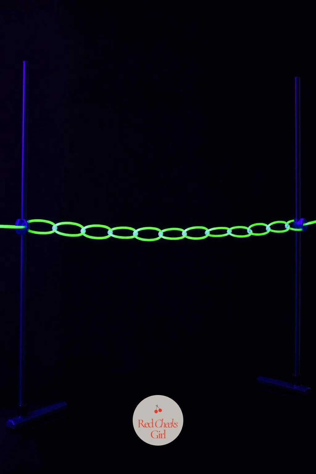 A Glow-Stick Limbo Line — Two guests hold either end of a strand of linked glow bracelets at chest height while music plays and the rest of the group takes