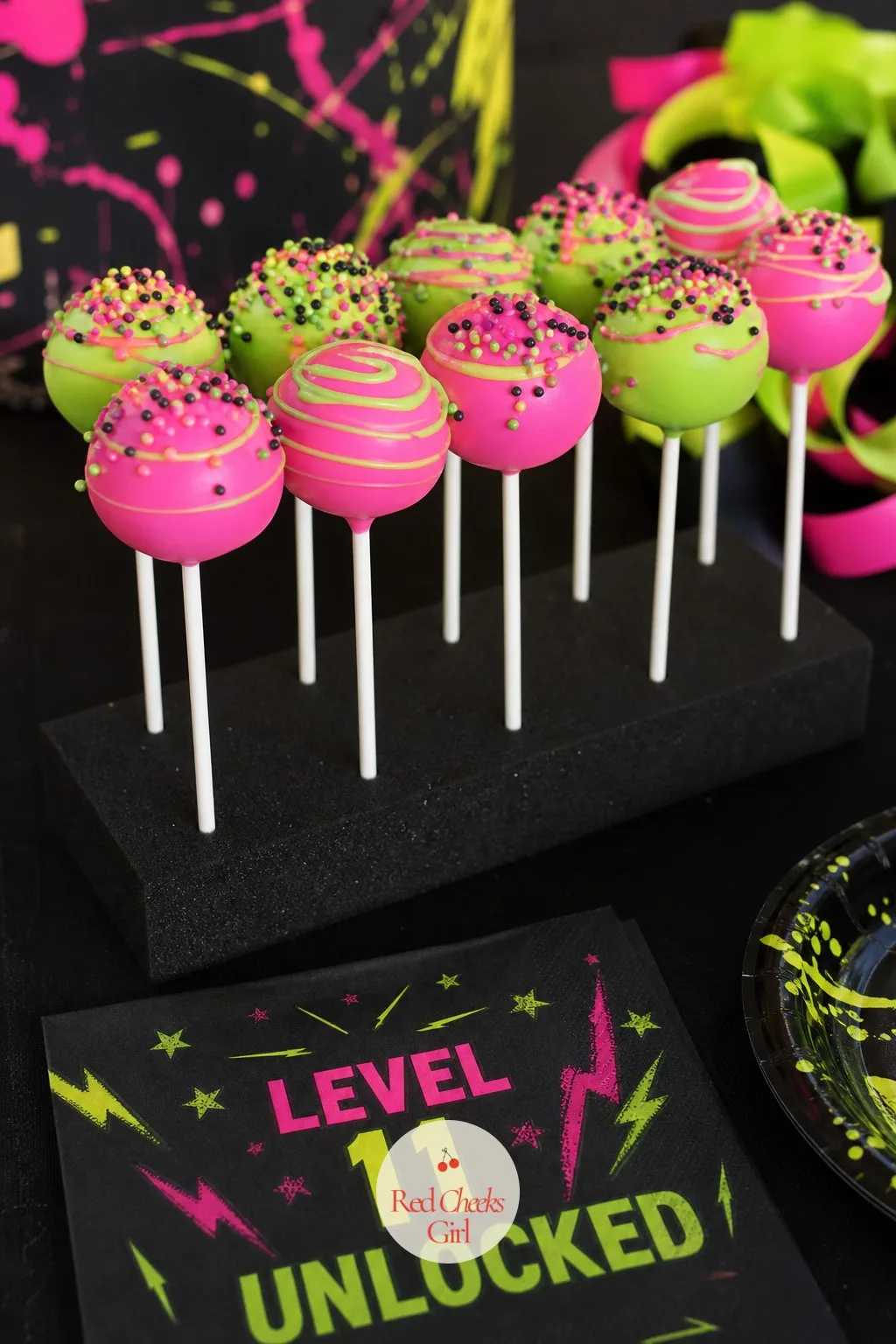 Neon Cake Pops — These do the same glow trick as the big cake but in a size she can hand straight to a friend. 11th birthday party ideas