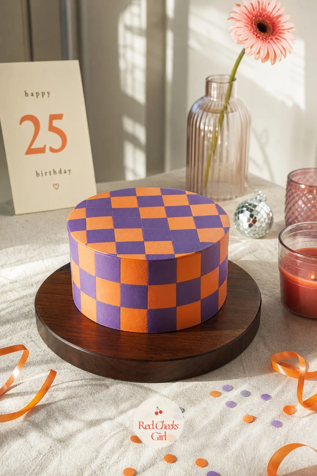 Checkerboard Bento Cake — A small cake iced in a tight purple and orange checkerboard pattern looks far more complicated than it actually is to pull off at