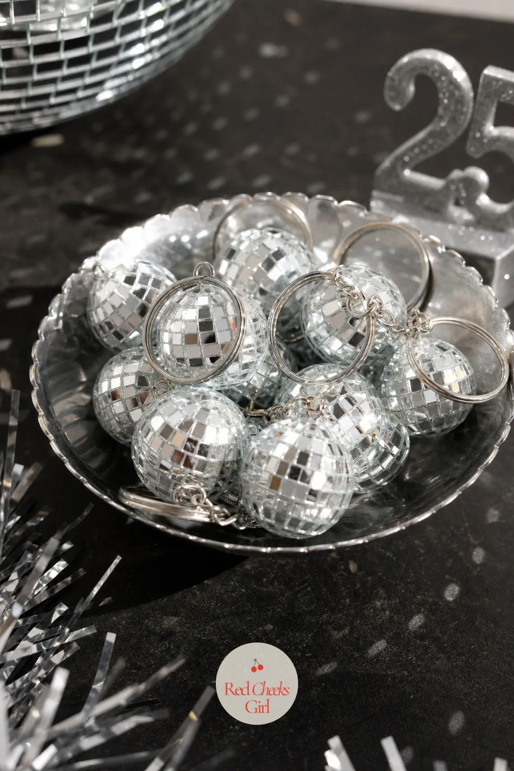 Disco Mini Mirror Ball Keychain Favors — A nod back to the showpiece at the start of the night, scaled down to fit a pocket. 25th birthday ideas for her