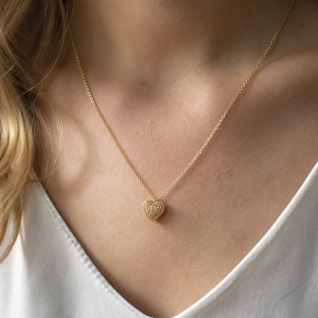 Gold Lace Heart Necklace — Not every woman at this party gets jewelry from the main gift, especially if she is the daughter organizing it rather than the