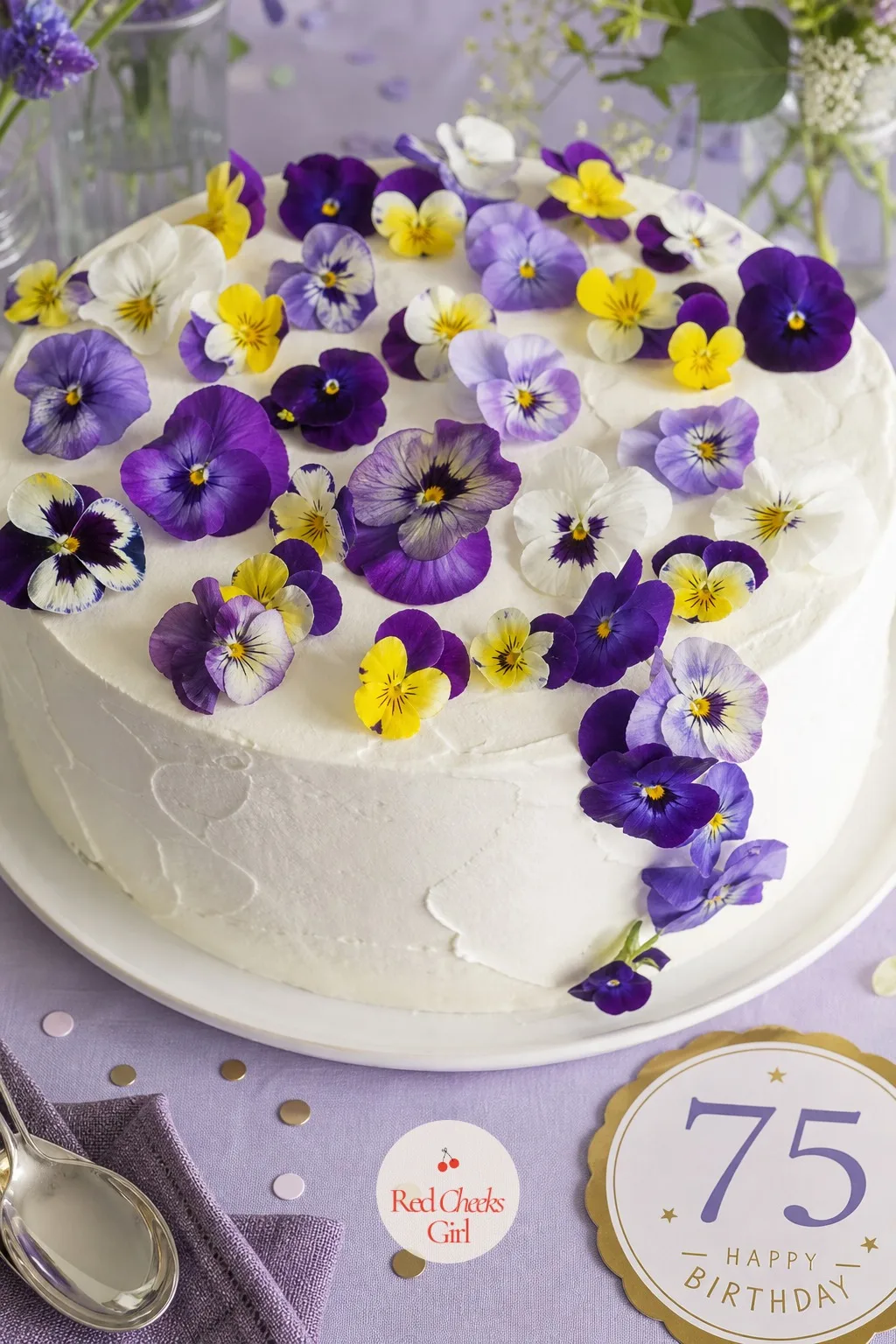 Real Pansies on Top — Fresh pansies on a cake do something fondant flowers never quite manage: they look like they grew there. 75th birthday cake