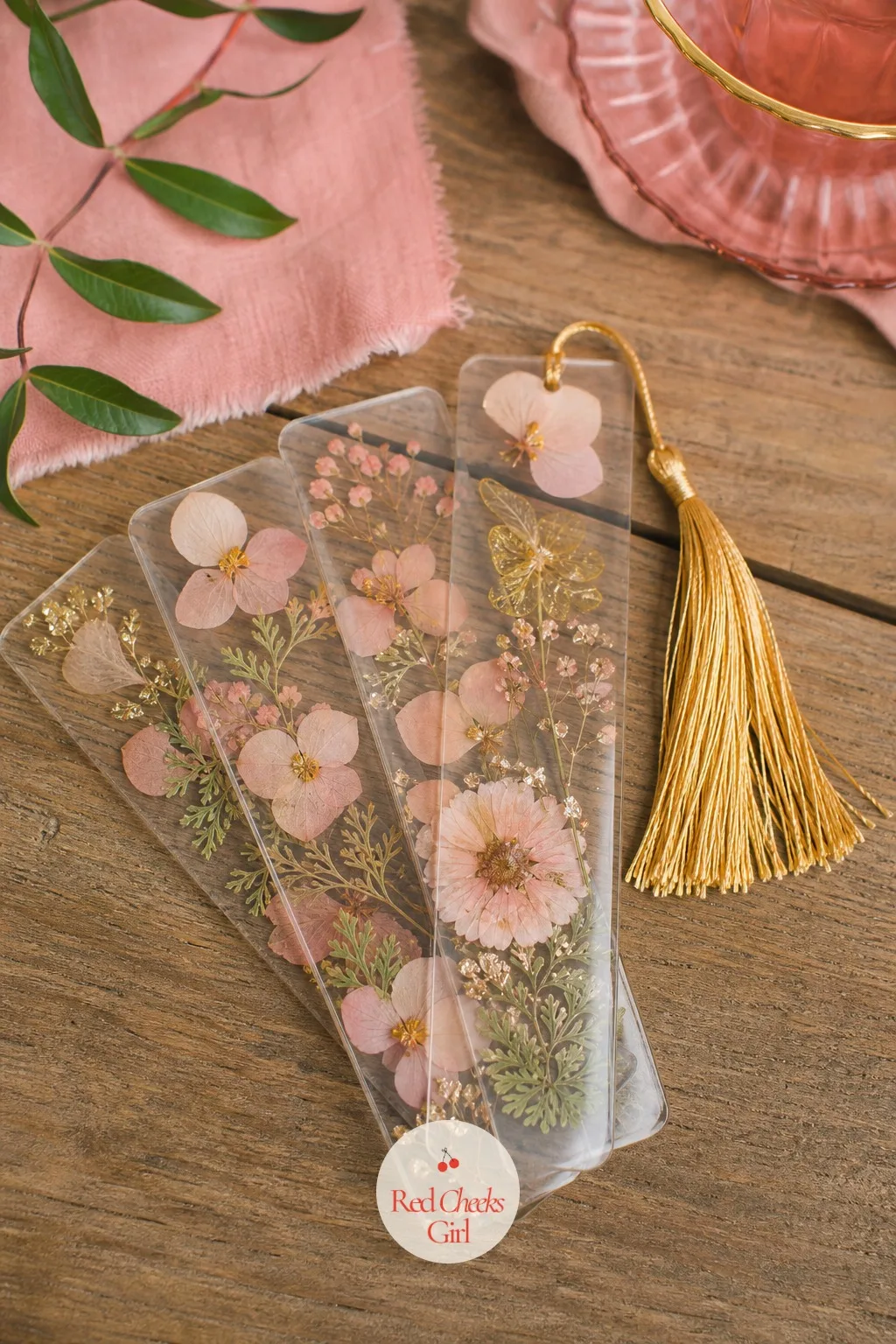 Pressed Flower Bookmarks — The smallest favor on this list is also the one most likely to turn up again years later, tucked inside a book she is partway