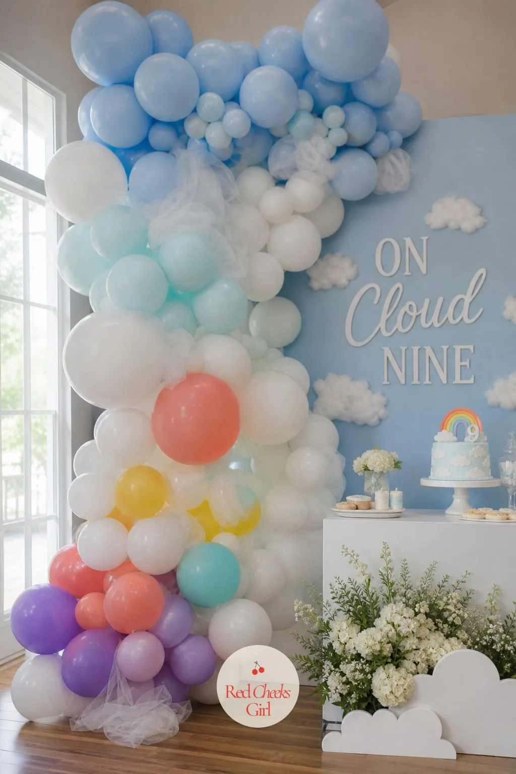 The Cloud Balloon Garland — A plastic garland strip gets taped along a wall or arch frame first, then balloons go on in a gradient: sky blue at the top fading