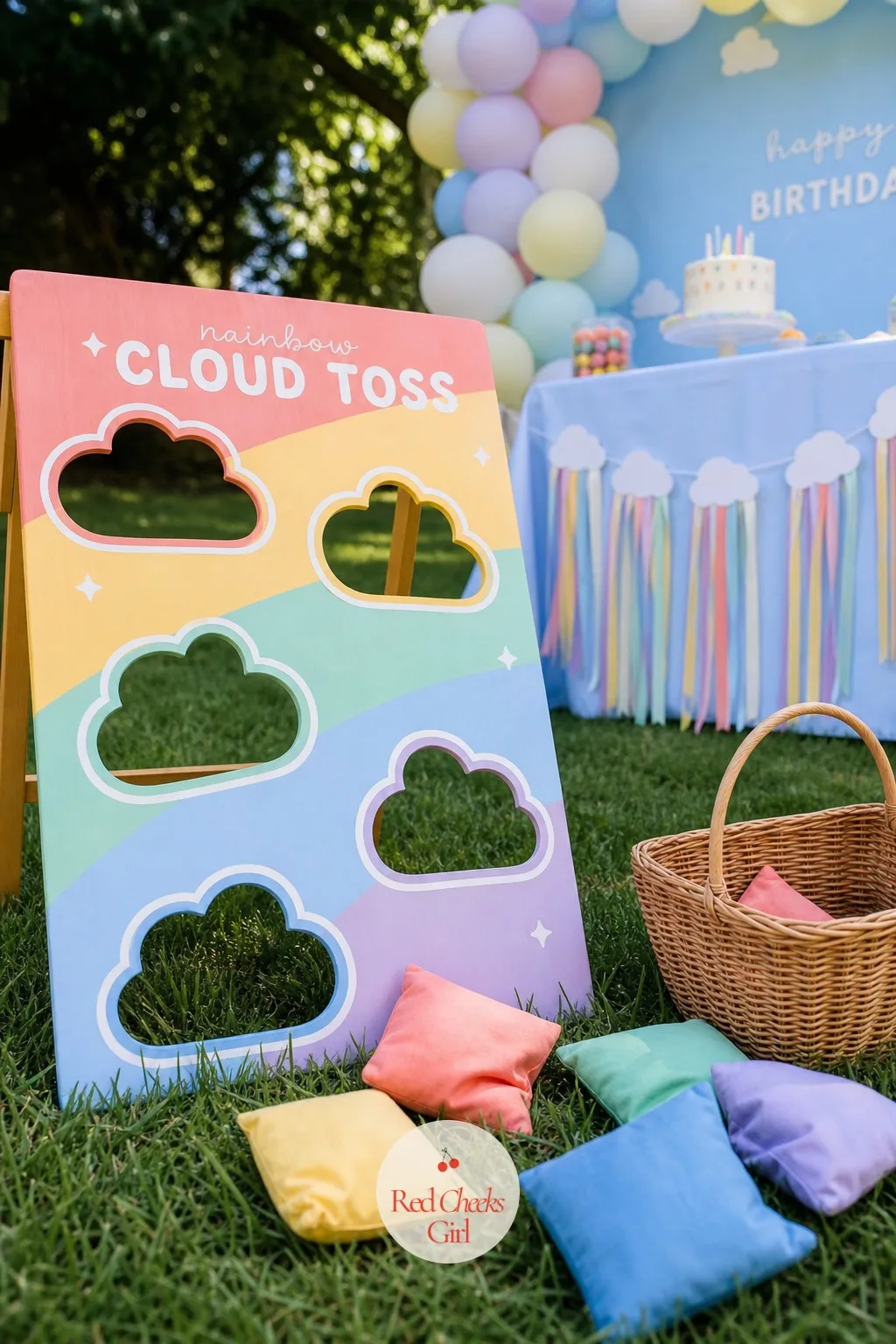 A Rainbow Bean Bag Cloud Toss — A painted plywood or foam board stands as the base, with several cloud shaped holes cut into it, each outlined in a different