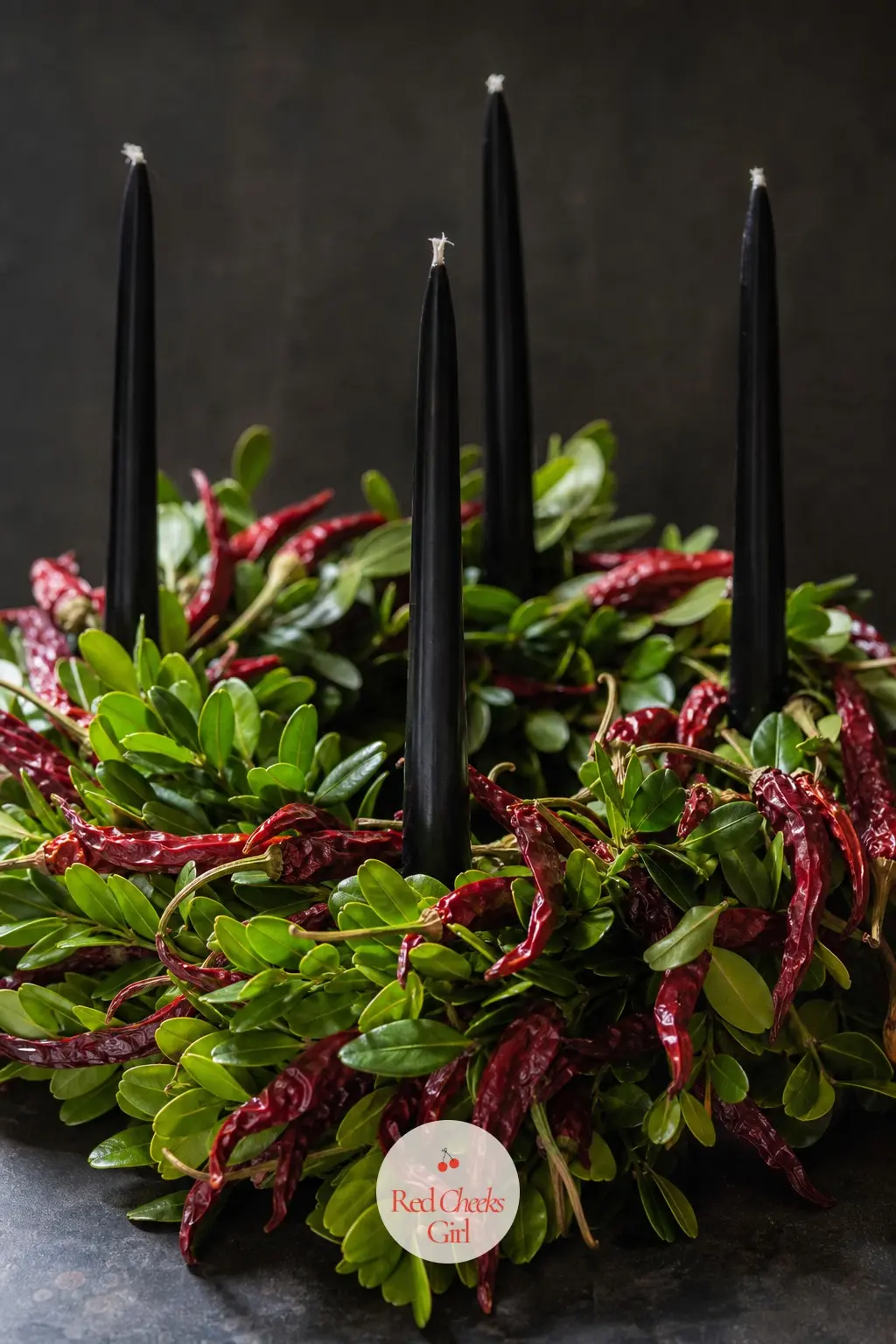 Black Taper Candles in a Preserved Myrtle and Dried Chili Ring — This one is for a household that already leans dark and modern rather than cozy and
