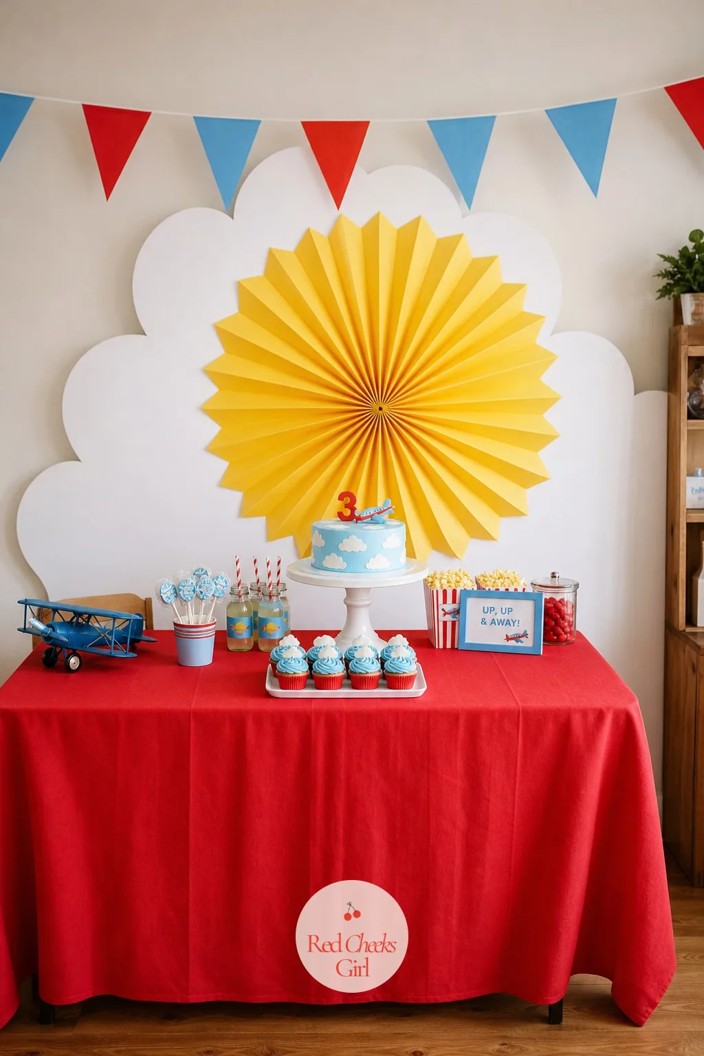 Scalloped Cloud and Sunburst Backdrop — If the wall behind the table is still bare, the ceiling clouds will feel like they are floating over nothing. Airplane