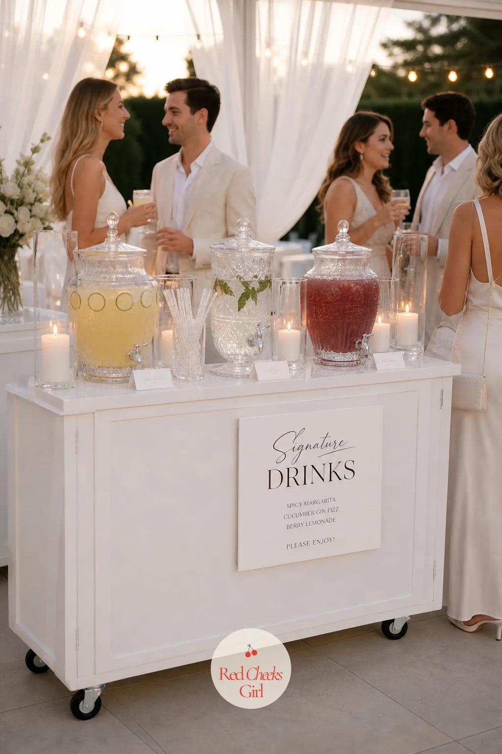 An All-White Signature Drink Station — A bar table covered in bottles and mixers is the one place the all-white room usually breaks down. All white wedding