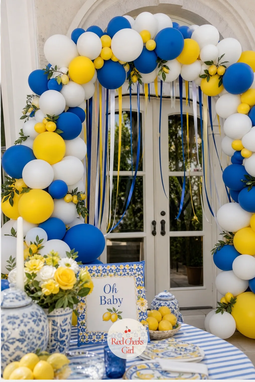 The Blue and Yellow Balloon Arch over the Entry — A doorway with nothing over it reads like a hallway. Amalfi coast baby shower theme