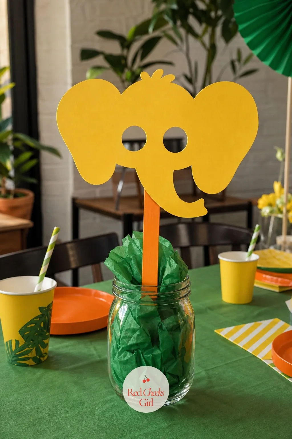 Elephant Mask On A Stick — Ears are doing most of the work here too, just at a smaller scale than the parade headbands. Animal themed birthday party