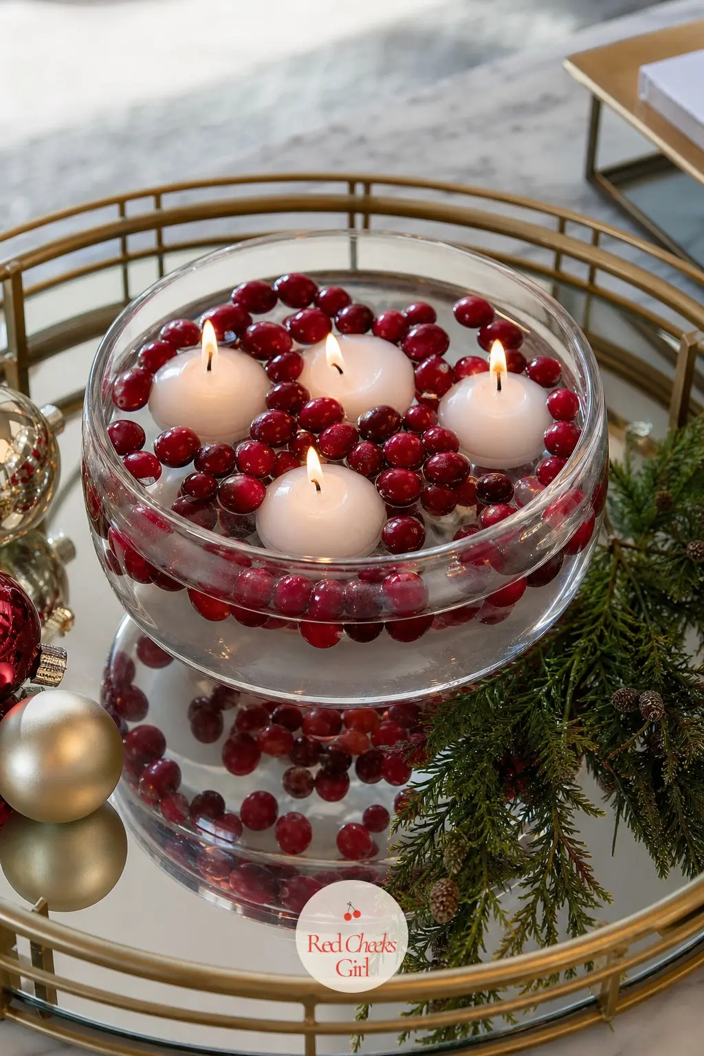 A Mirrored Tray Centerpiece of Floating Candles — A coffee table centrepiece does not need height to earn its keep, just light. Apartment christmas decor