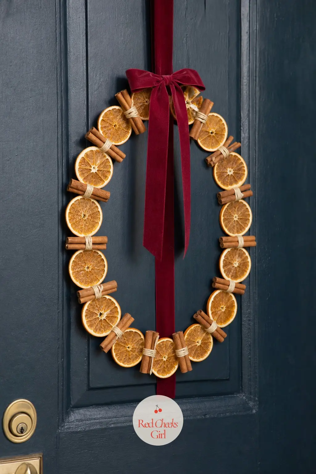 A Slim Door Wreath of Dried Orange Slices and Cinnamon Sticks — A door wreath does not need greenery to read as Christmas. Apartment christmas decor