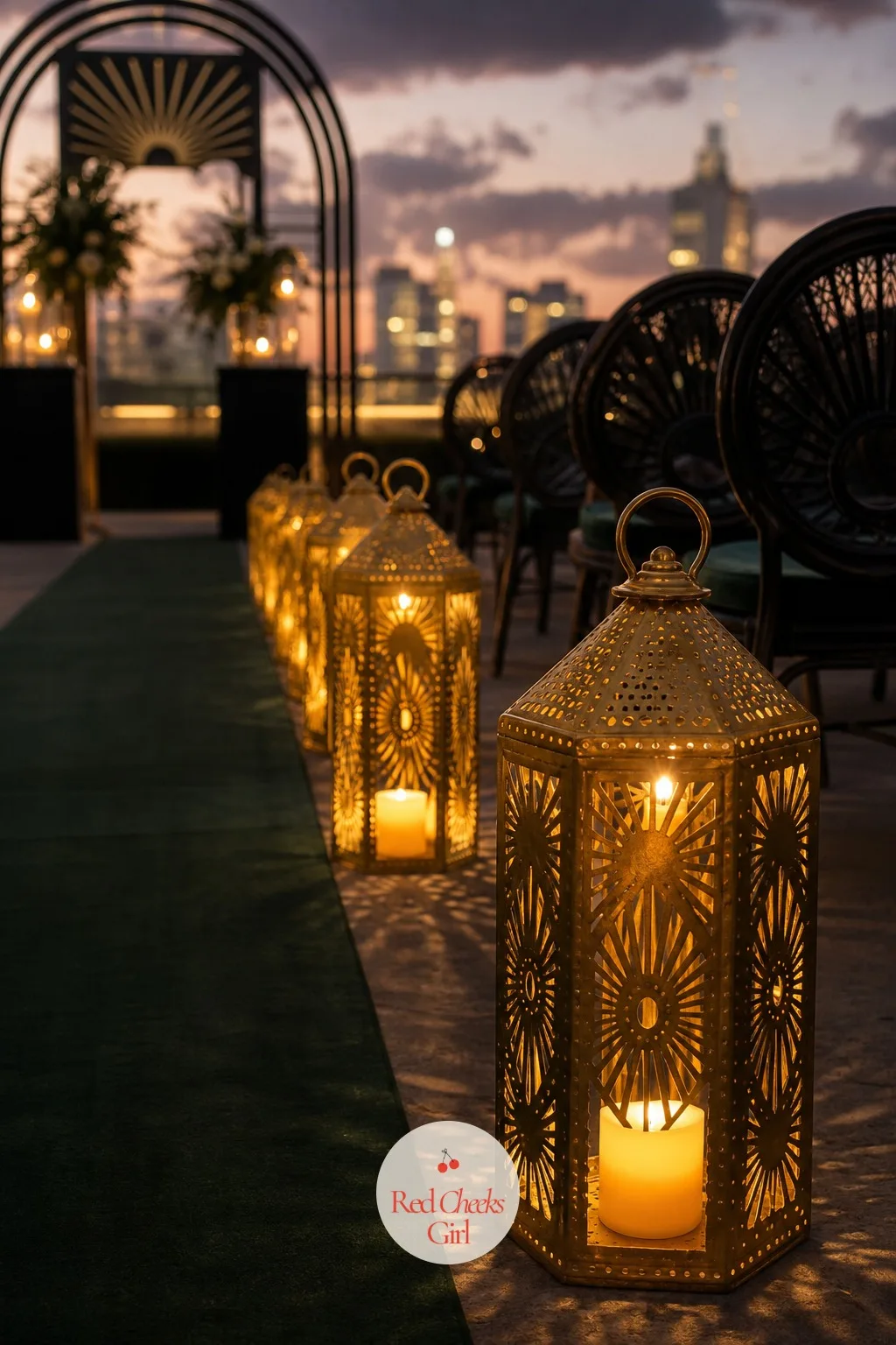 Brass Lantern Aisle Lighting — Once the sun drops even slightly, an aisle needs its own light or the runner and the arch both go flat in photographs. Art deco