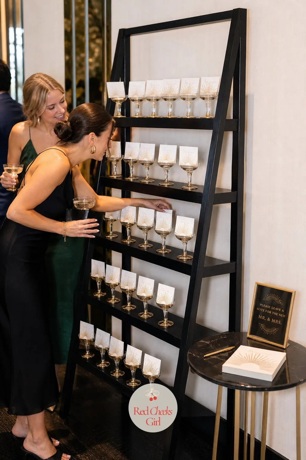 Champagne Coupe Guest Book Wall — A clipboard and a pen never matches a room this dressed up, so the guest book gets reinvented as something guests actually