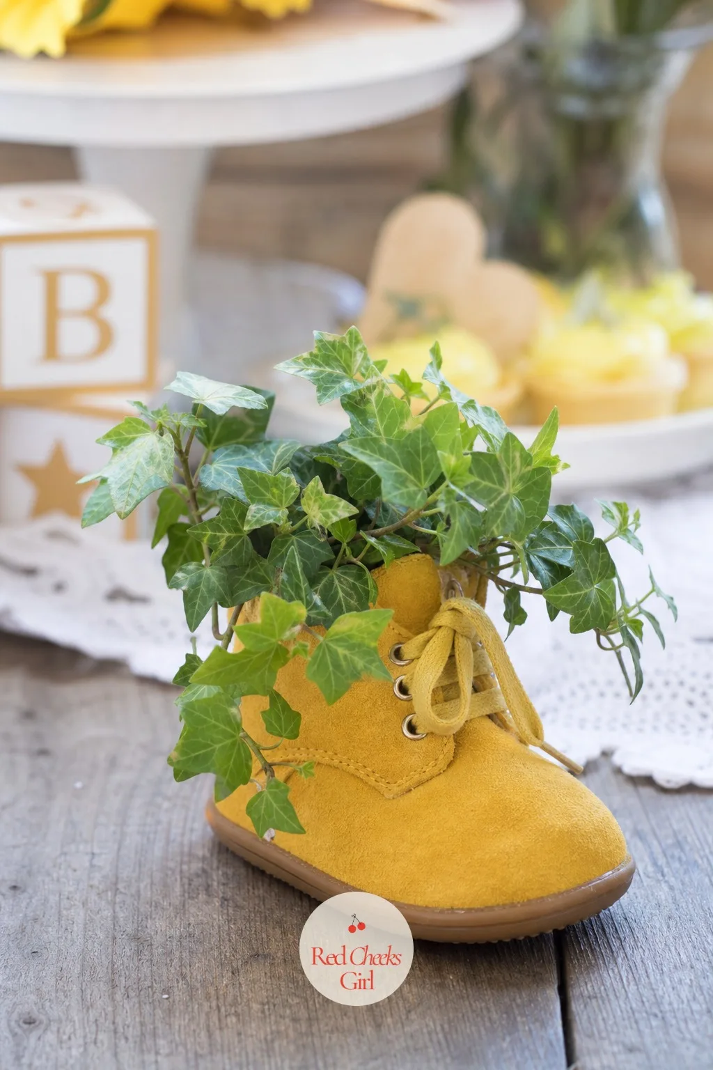 Baby Shoes as Planters — A mustard yellow baby boot, foam or felt packed inside to hold moisture, becomes a tiny planter for trailing greenery that spills over