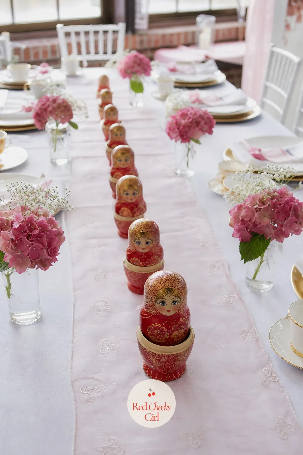 Nesting Dolls — A set of red and gold painted nesting dolls, opened and arranged in a descending row from largest to smallest, makes a graphic little staircase