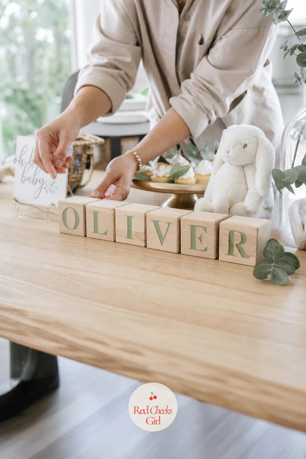 Wooden Alphabet Blocks Spelling the Name — She will say a name spelled out in blocks is predictable, and it is, right up until it is sitting in natural oak and