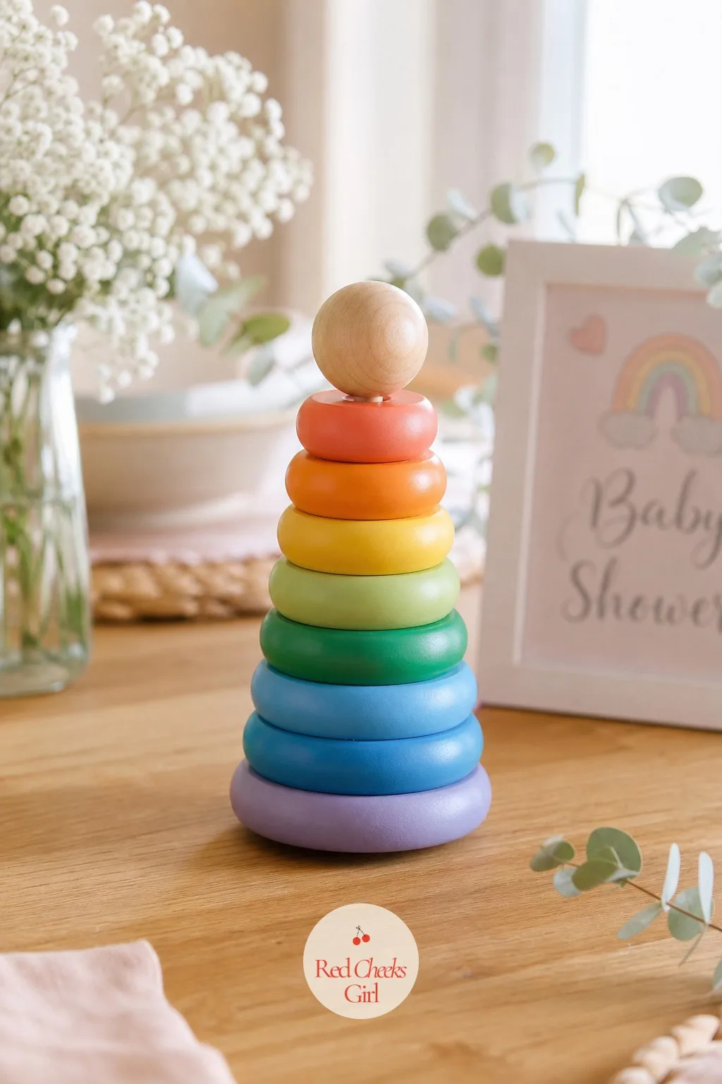 Wooden Stacking Rings — A classic stacking toy, rainbow-painted rings on a natural dowel, stands exactly as it was designed to and needs nothing added to look
