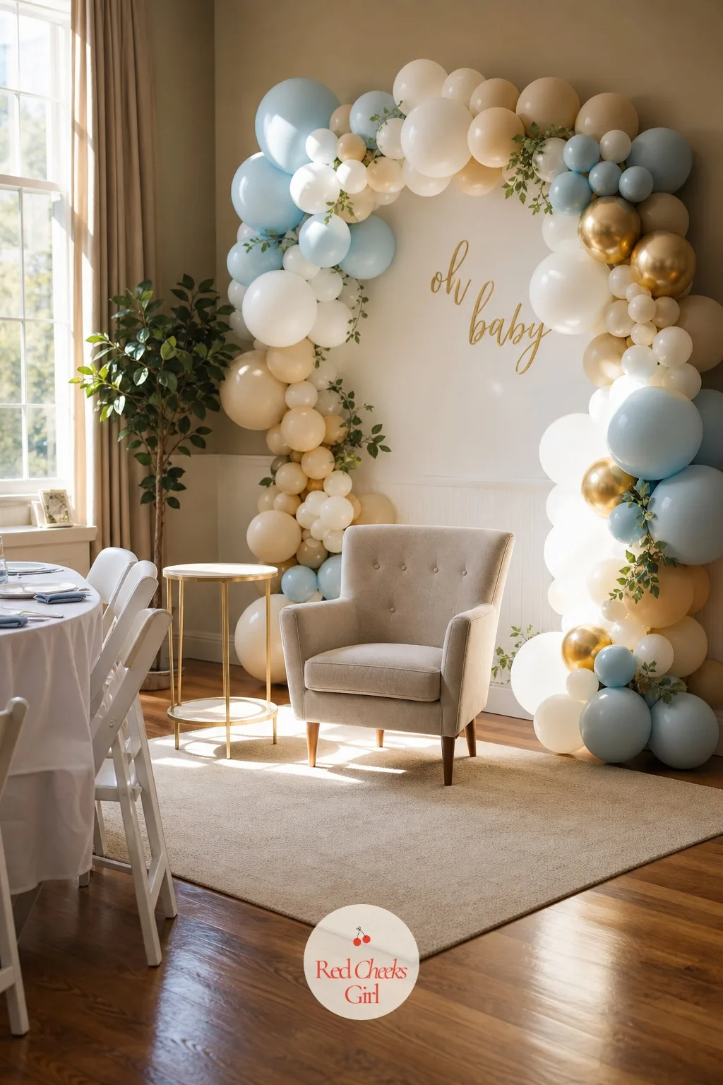 Put One Camera-Ready Corner Where the Gifts Get Opened — A single armchair sits angled toward a soft balloon garland, a small side table beside it cleared for