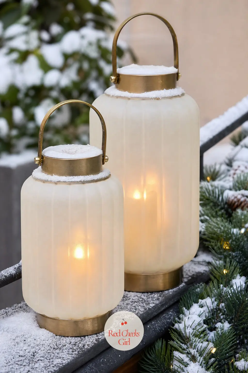 A Pair of Frosted Ivory Lanterns With Gold Flameless Candles on the Railing Ledge — A real flame on a windy balcony is a genuinely bad idea, so this is where