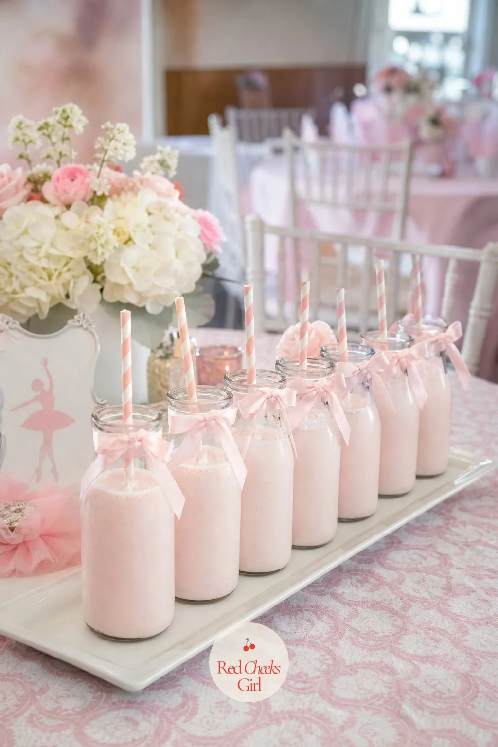 Strawberry Milk in Glass Bottles with Paper Straws — A pitcher at a children's table means someone has to pour for every small cup. Ballerina themed birthday