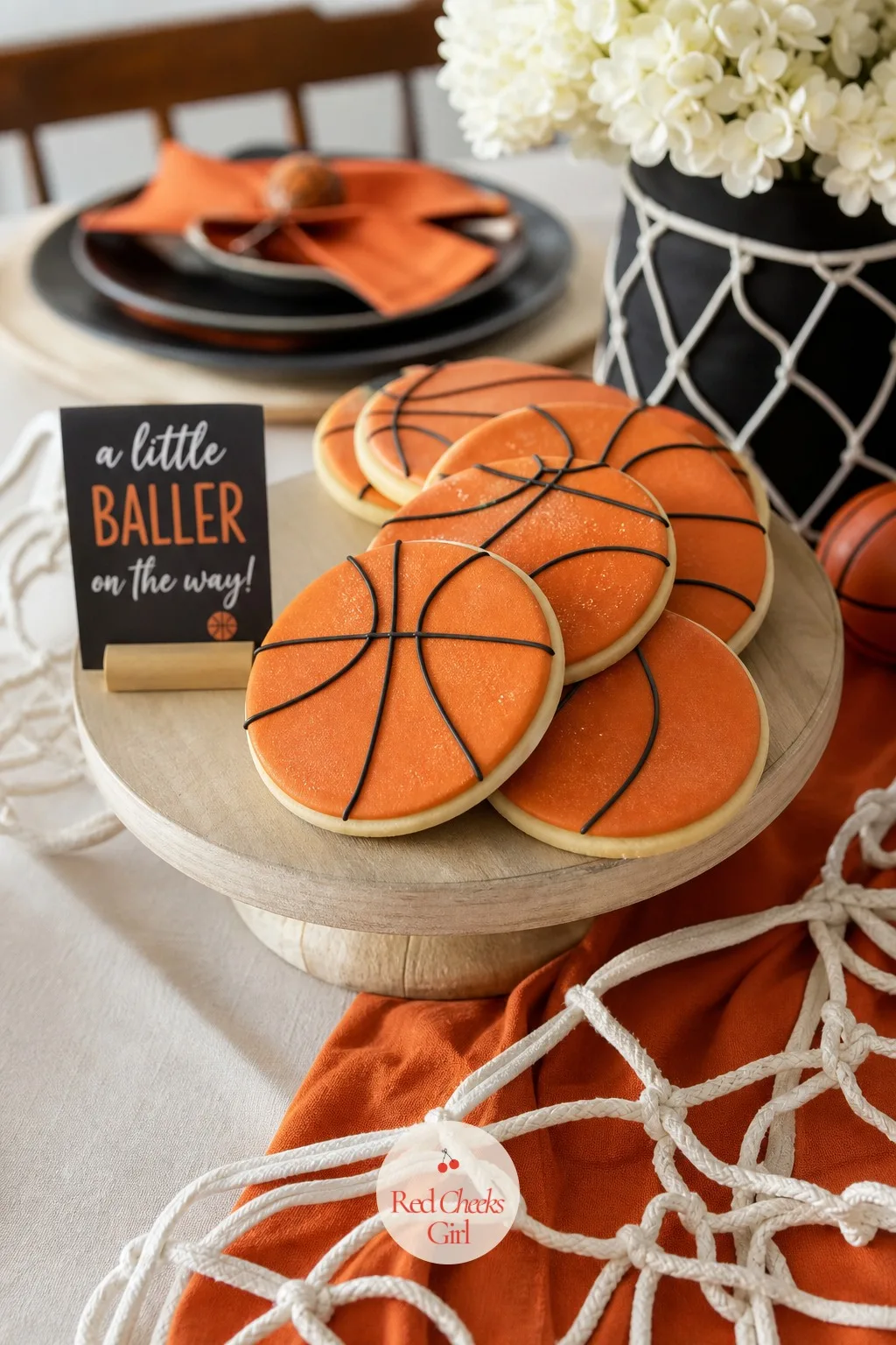 Basketball-Shaped Cookies — Round sugar cookies, iced in a bright warm orange with thin piped black seam lines, do more for a dessert table than almost