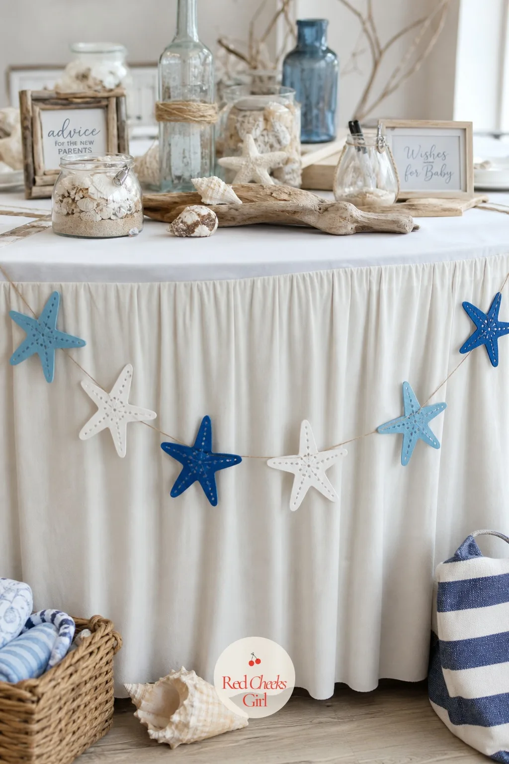 Paper Starfish Garland — This is the detail that softens a sharp-edged table or mantel without adding another color. Beach theme baby shower ideas