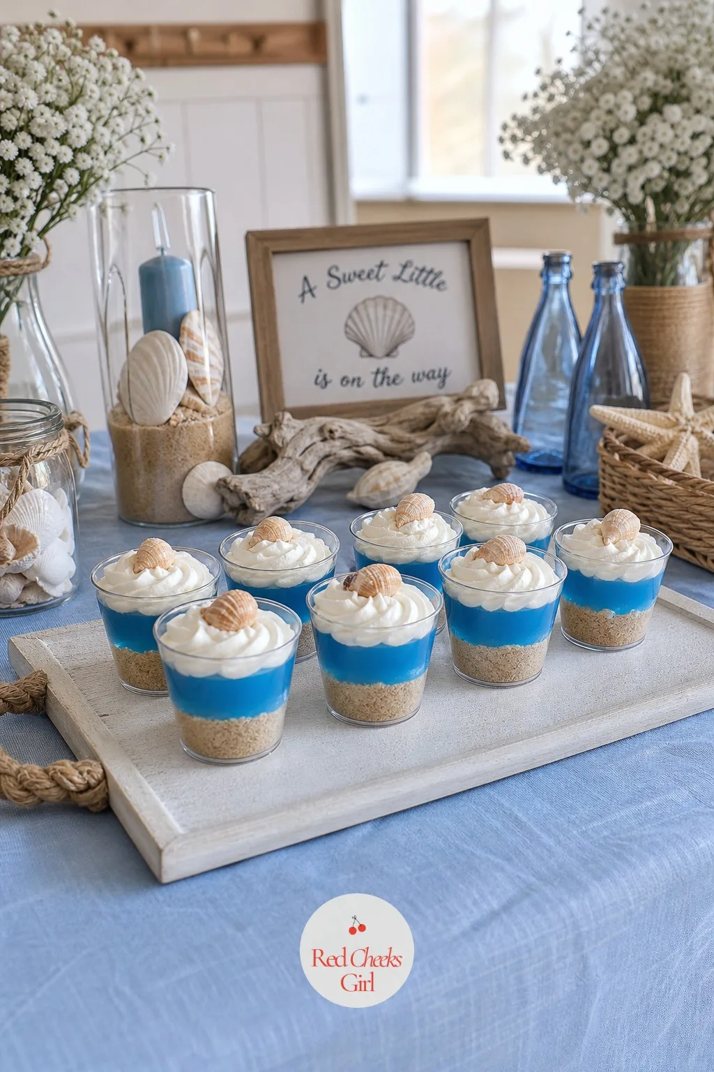 Sand Dessert Cups — Four or five of these lined up on a tray do more for the table than a single big dessert ever could. Beach theme baby shower ideas