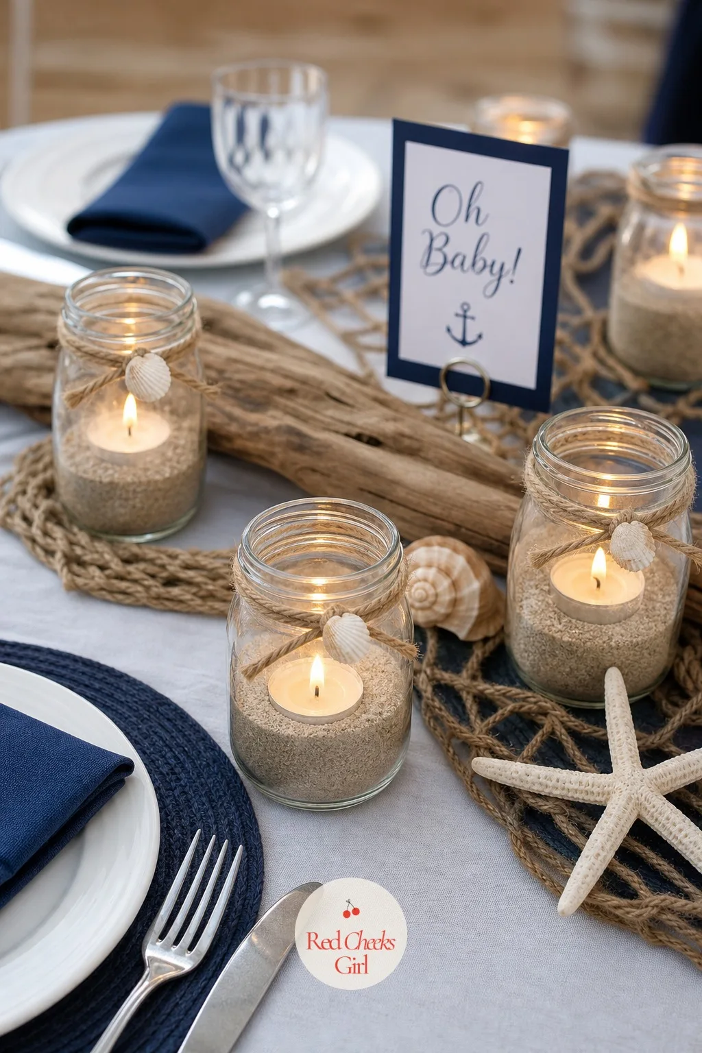 Sand and Glass Jar Luminaries — These give the table a soft glow once the afternoon light starts to fade, without a single plug or cord in sight. Beach theme