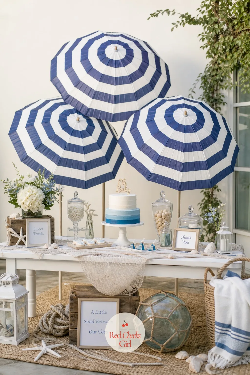 Striped Umbrella Canopy — This is the shade that makes a backyard table read as beachfront rather than just outdoors. Beach theme baby shower ideas
