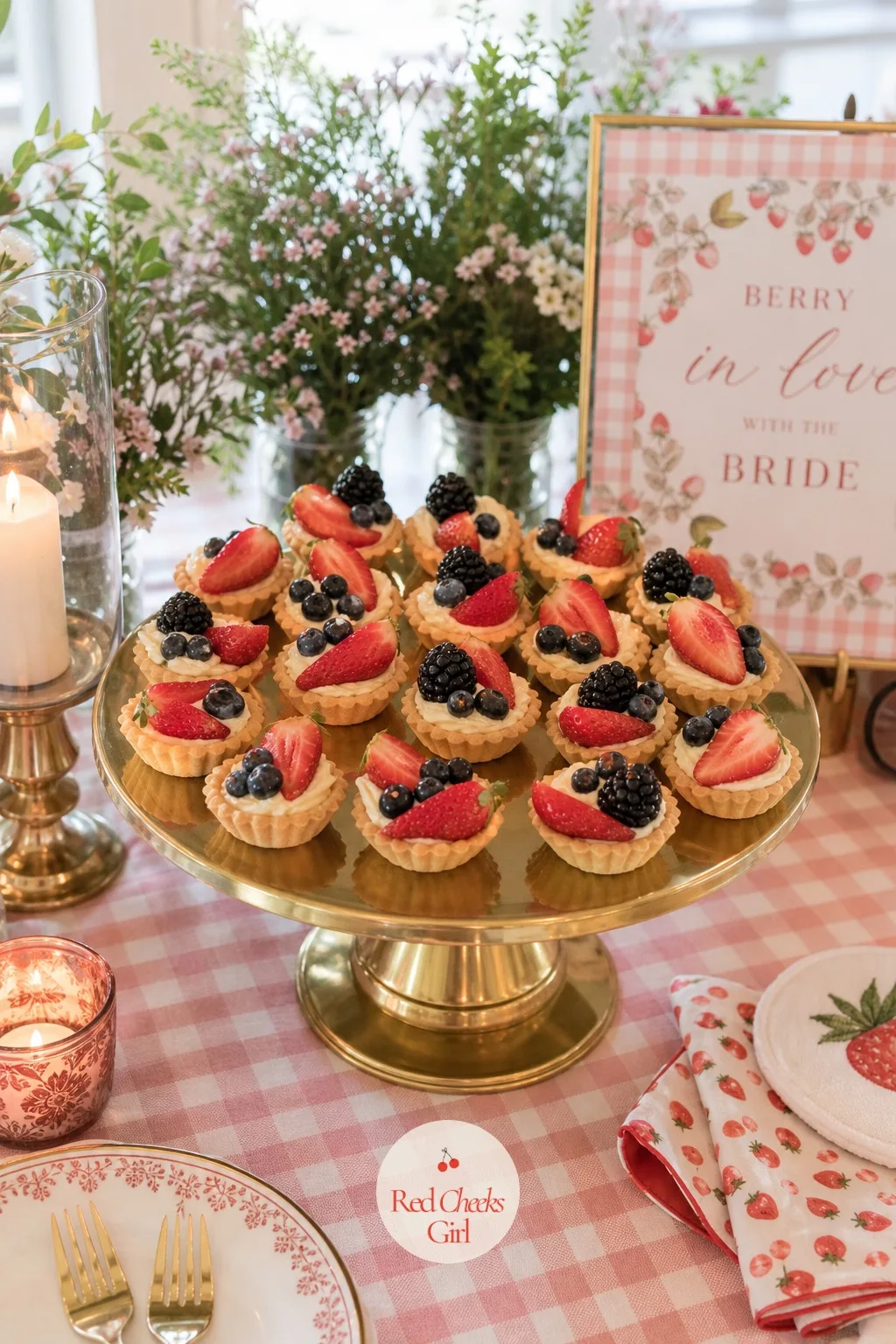 Berry Tarts — Smaller than the tower and easier to pick up without a plate, these sit nearby: mini tart shells filled with pastry cream, topped with halved
