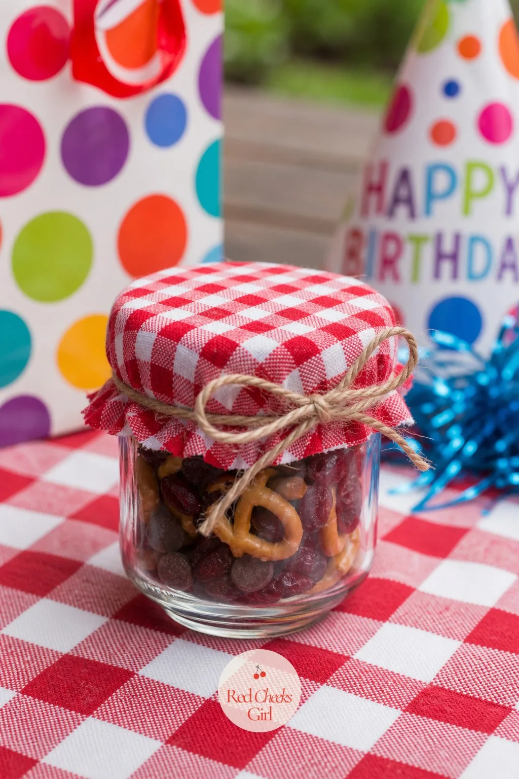 A Mini Jar Of Trail Mix Or Snack Mix — For a guest list that skews a little older, or a party running through an actual mealtime, a savory mix beats another