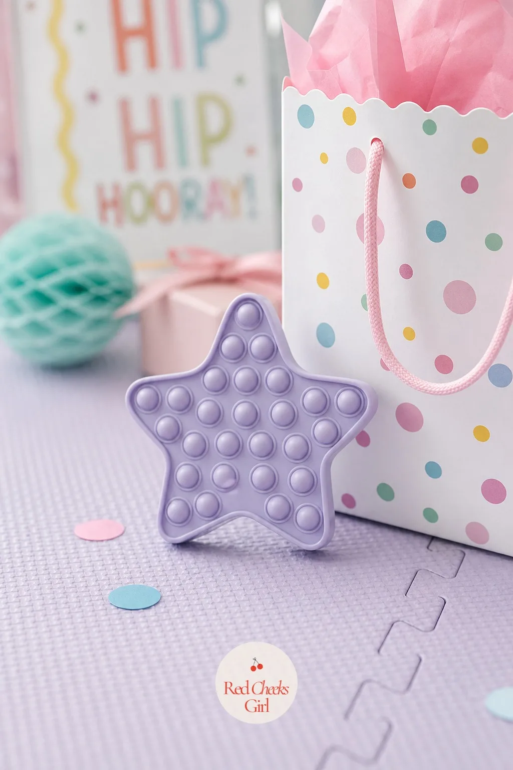 A Squeeze Sensory Toy — Somewhere between a toy and a fidget, a soft push pop or squeeze toy gives a toddler something to do with restless hands during the