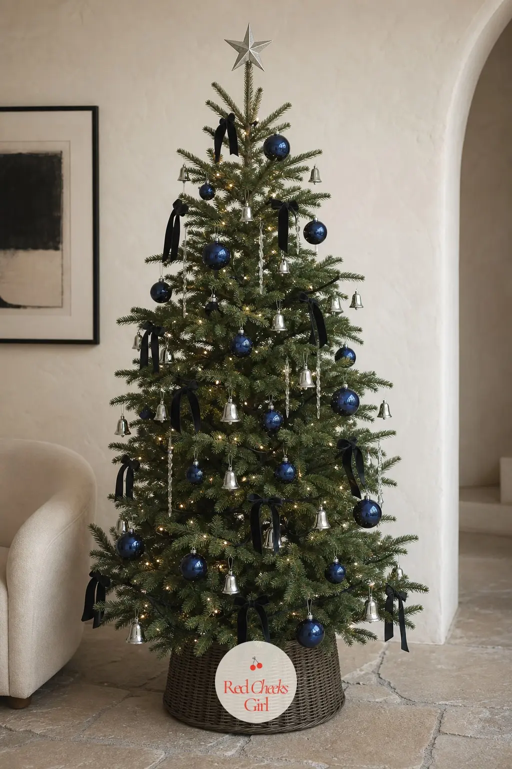 A Potted Black and Sapphire Tree on Stone Floors — In a pale plaster room with a curved cream chair and a stone floor, this real potted living tree wears