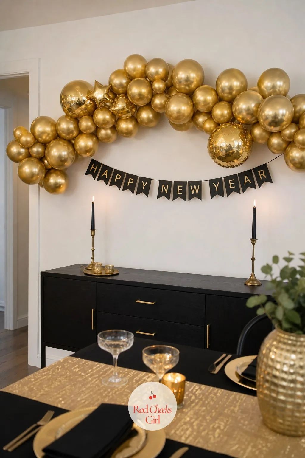 A Gold Balloon Garland Arched Over the Black Sideboard — The drinks table usually gets set up last and it shows, a few bottles dropped on bare wood five