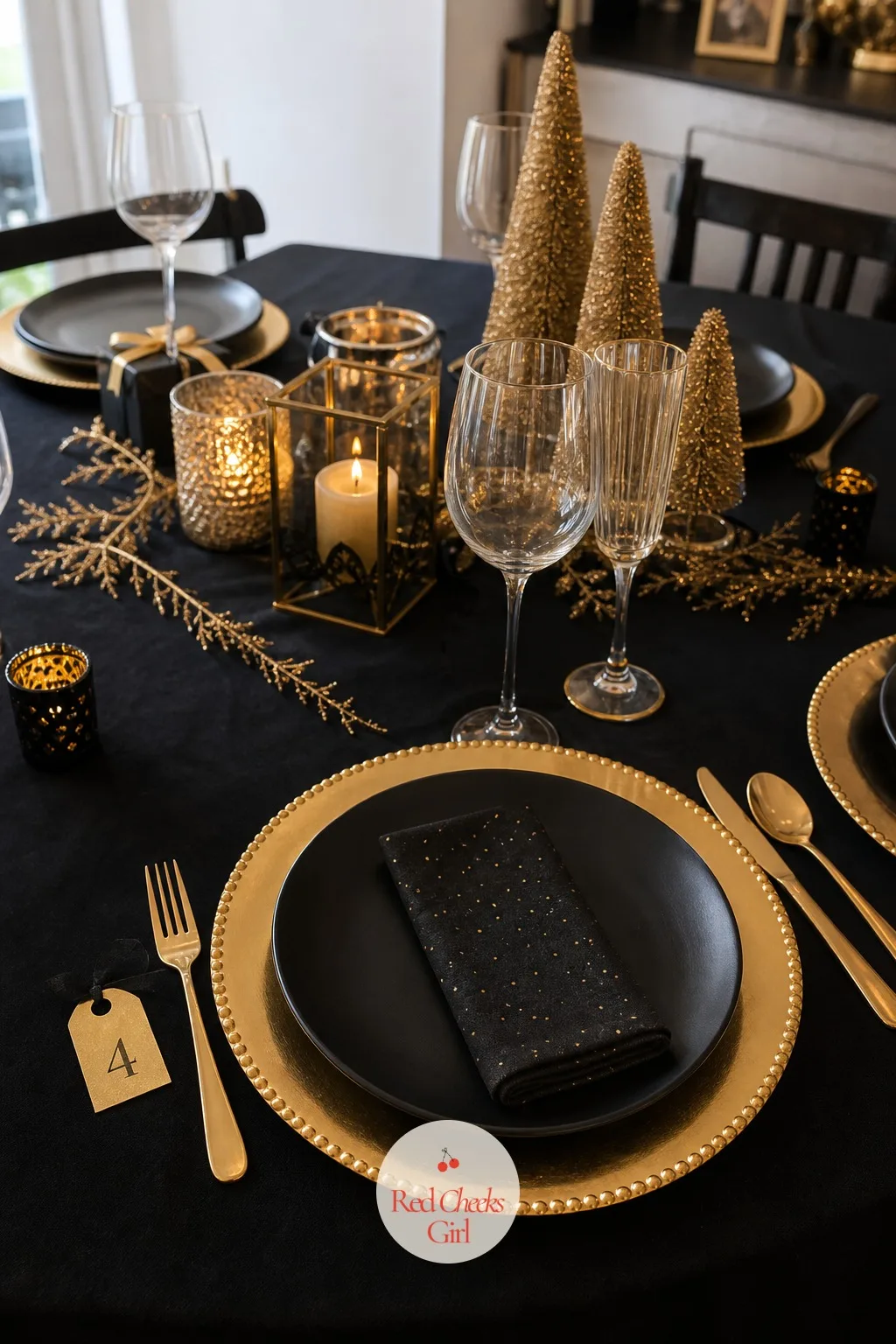 Gold Chargers Under Black Dinner Plates With a Small Number Tag — Plain white plates alone can make the table feel like it's just dinner, nothing more. Black