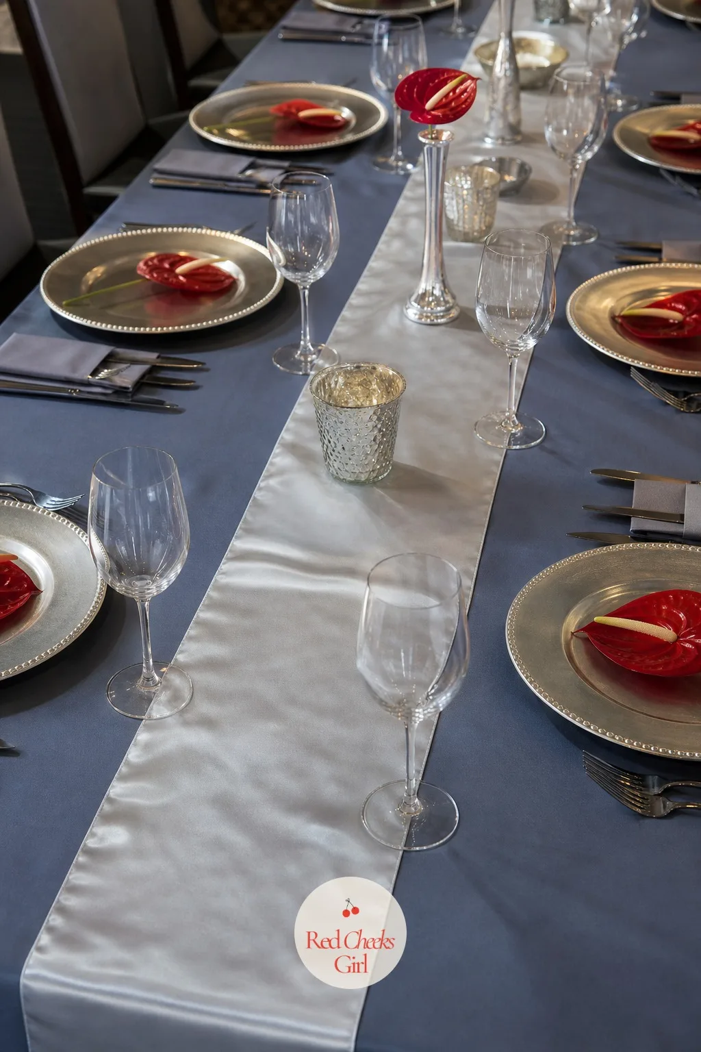 Pressed Satin Cloths And A Silver Runner — Wrinkled linen photographs badly no matter how the rest of the table looks, so this one detail gets ordered rather